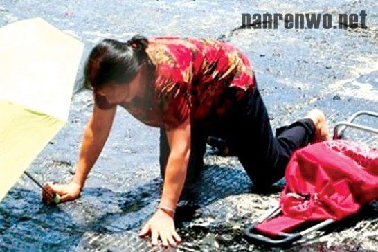 南宁路面沥青致出行市民被“黏住”