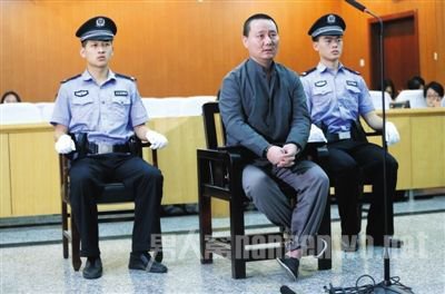 被控诈骗的田福生在庭审时神情自若